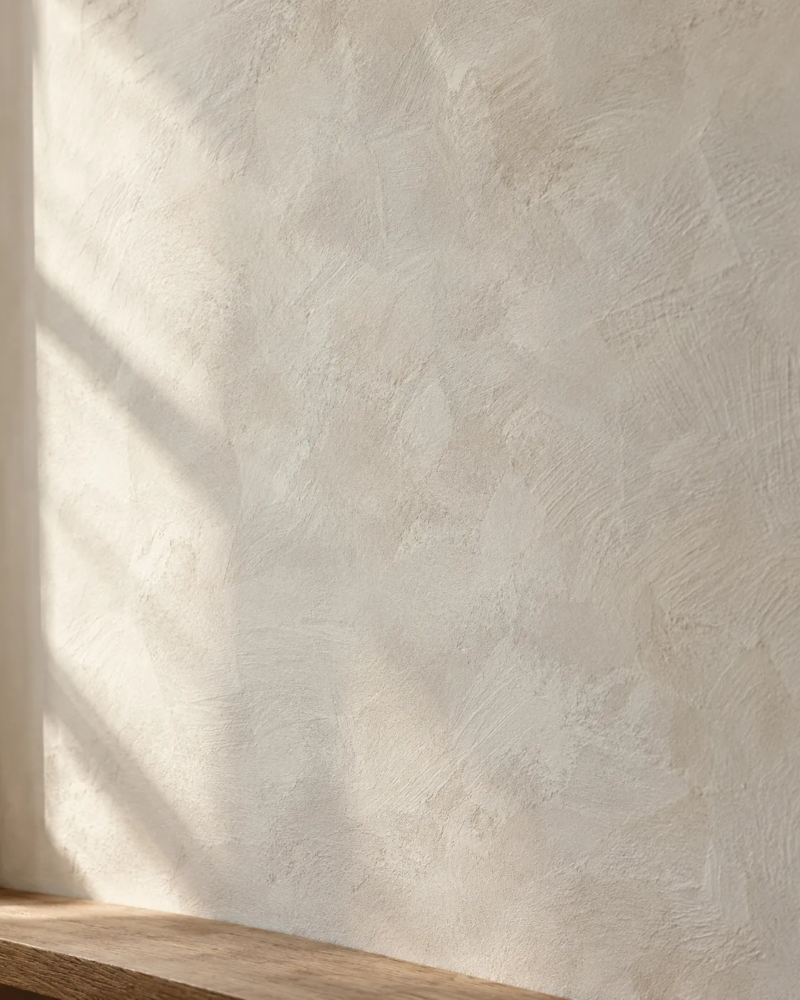 Close view of soft clouded limewash texture in raking daylight